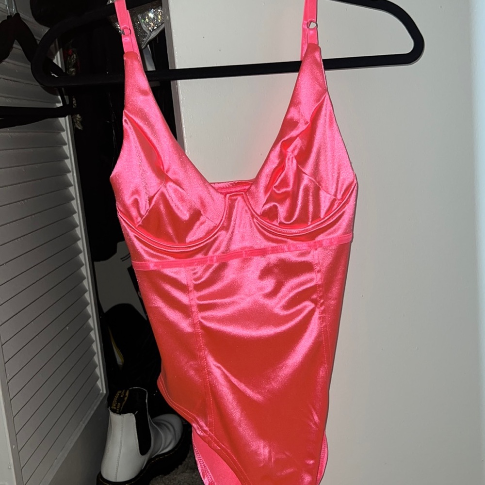 Pink bodysuit button